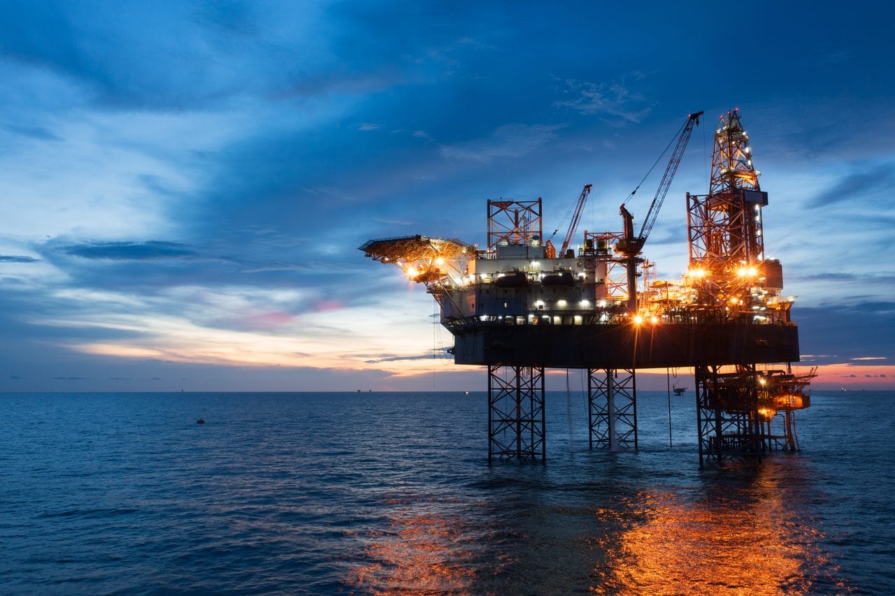 Offshore oil rig at dusk